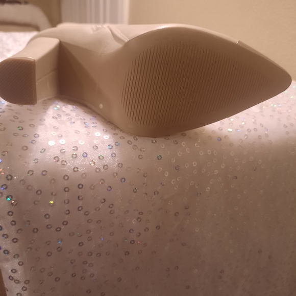 White Thigh High Boots with silver tips around toe and buckle around ankles. - Picture 5 of 5